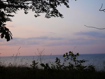 Scenic view of sea against sky at sunset