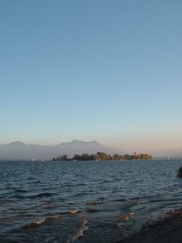 Scenic view of sea against clear blue sky