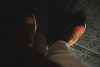 Low section of man standing on floor