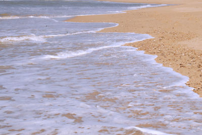 High angle view of surf on beach