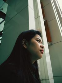 Portrait of young woman looking away