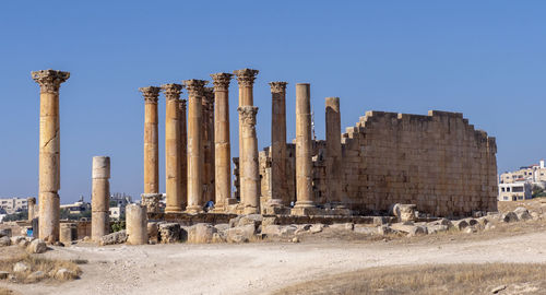 Panoramic view of old ruins against clear sky