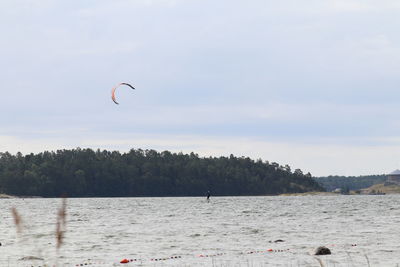 Scenic view of sea against sky with kite