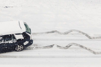 Close-up of car on snow