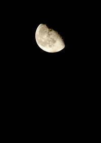 Low angle view of moon against clear sky at night