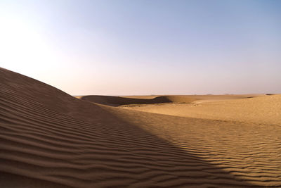 Scenic view of desert against clear sky