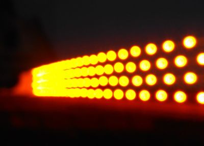 Close-up of illuminated yellow lights at night