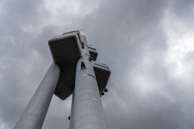 Low angle view of telephone pole against sky