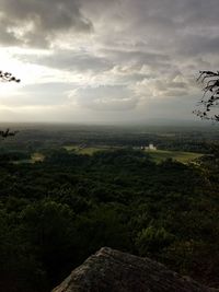 Scenic view of landscape against cloudy sky