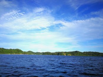 Scenic view of lake against blue sky