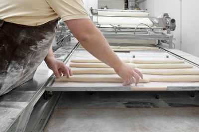 Low section of man working at workshop