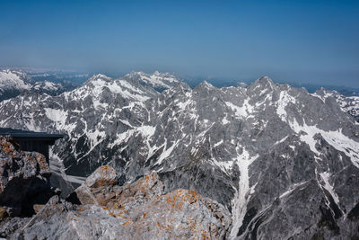 Aerial view of snowcapped mountains against sky