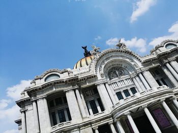 Low angle view of statue of building against sky