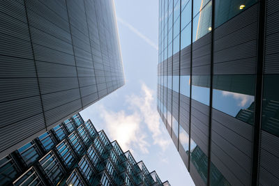 Low angle view of building against cloudy sky