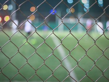 Field seen through chainlink fence