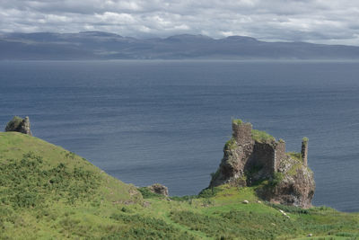 Old ruined coastal castle, brochel castle, on the  isle of raasay in scotland. sea landscape