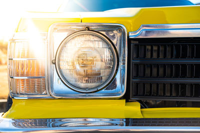 Close-up of yellow car headlight