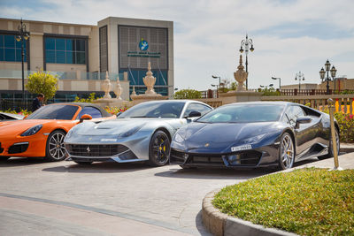 Cars on street against buildings in city