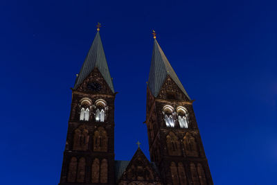 Low angle view of traditional building against clear blue sky