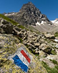 Scenic view of rocky mountains against blue sky