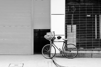Bicycle against wall in city