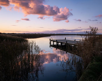 Nymindegap pier with kayak, at sunset