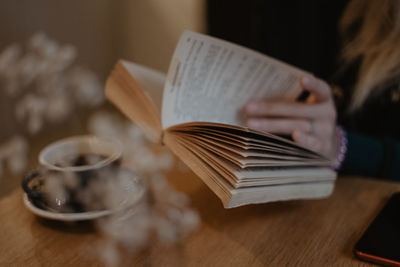 Close-up of open book on table