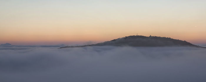 Scenic view of silhouette mountain against sky during sunset