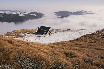 Scenic view of land against sky during winter