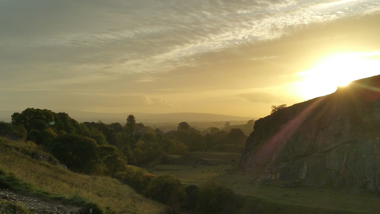 SCENIC VIEW OF SUNSET OVER MOUNTAIN