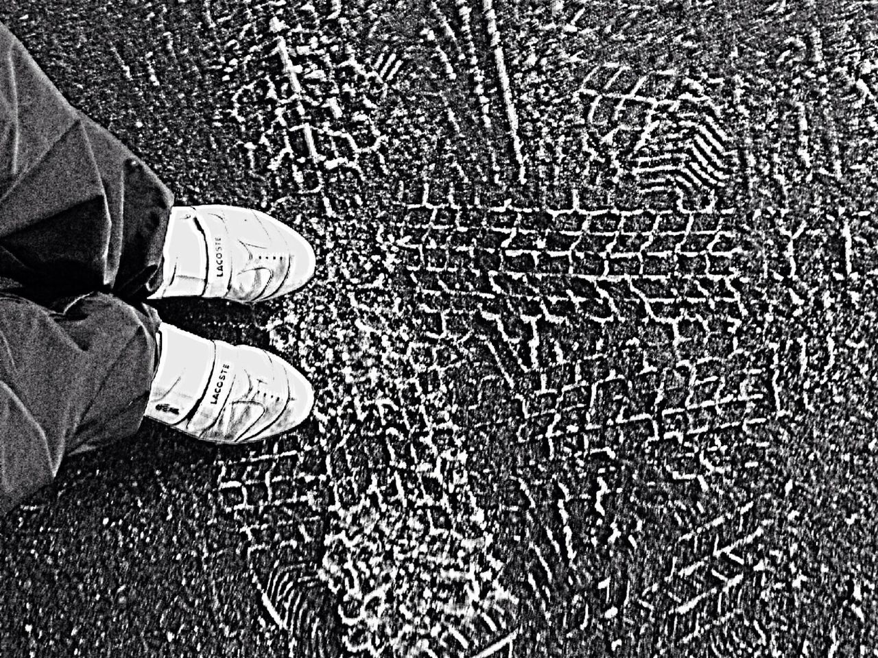 low section, person, shoe, high angle view, indoors, human foot, pattern, personal perspective, footwear, part of, standing, jeans, directly above, lifestyles, close-up, textured, unrecognizable person