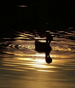 Reflection of people on lake