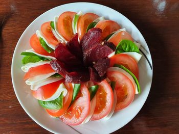 High angle view of fruits in plate on table