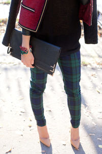 Low section of woman standing outdoors