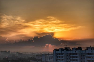 Cityscape against sky during sunset