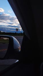 Close-up of airplane seen through car windshield