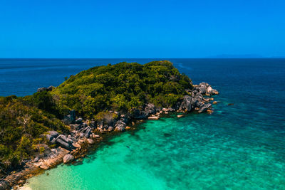 Scenic view of sea against clear blue sky