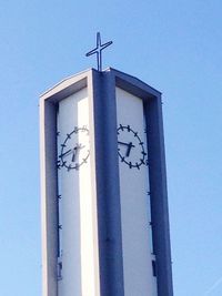 Low angle view of built structure against clear blue sky