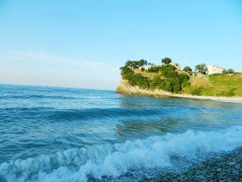 Scenic view of sea against clear blue sky