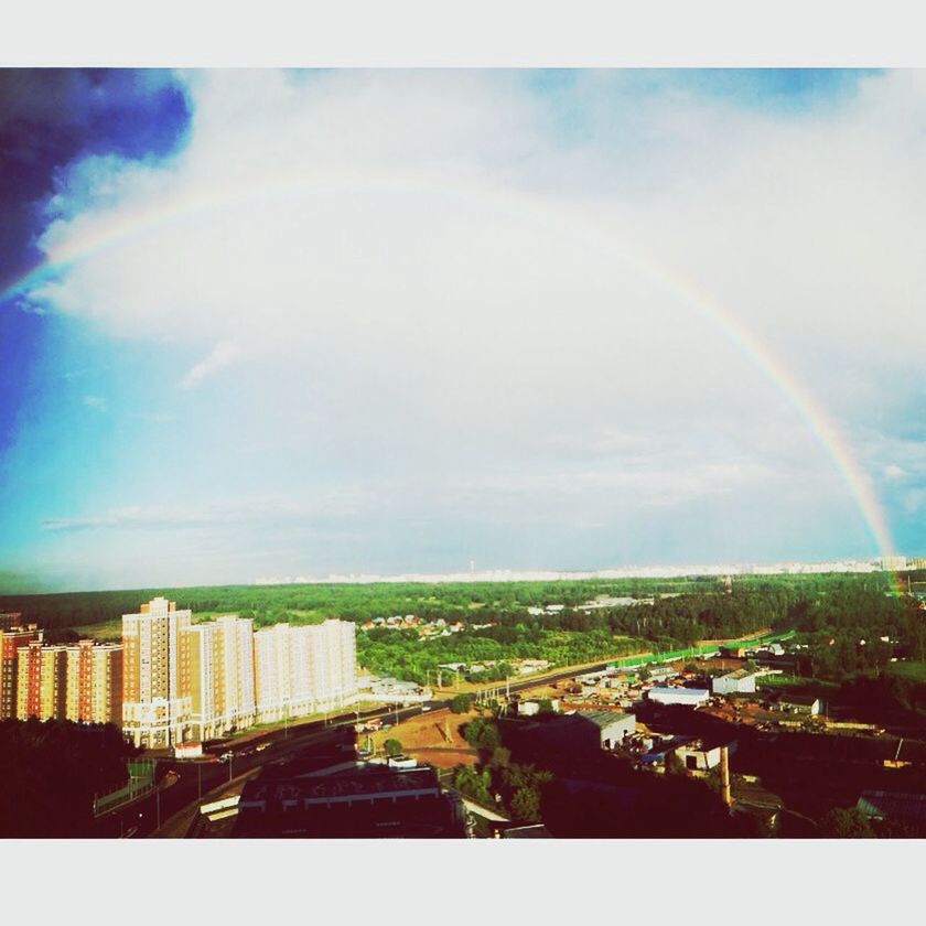 sky, building exterior, architecture, built structure, cloud - sky, city, auto post production filter, transfer print, cloud, rainbow, cloudy, cityscape, nature, scenics, outdoors, residential district, day, beauty in nature, no people, residential building