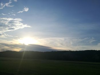 Scenic view of field against sky during sunset