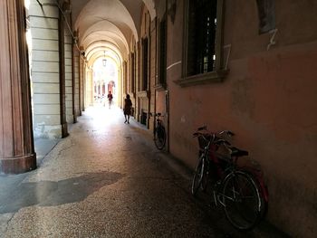 Man cycling in corridor