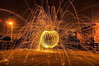 Illuminated ferris wheel at night