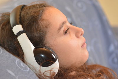 Close-up portrait of woman lying down