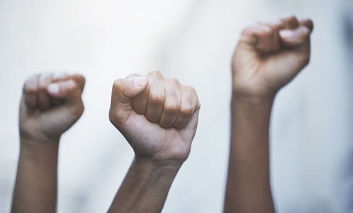 Cropped image of hand against white background