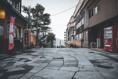 Surface level of street amidst buildings in city