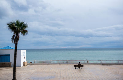 Scenic view of swimming pool by sea against sky