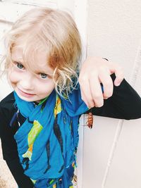 Close-up of cute girl with arms raised