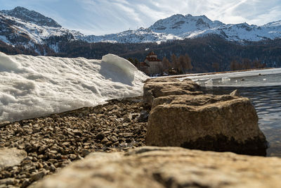 Silvaplana, switzerland, february 21, 2023 winter landscape scenery with a frozen lake of silvaplana