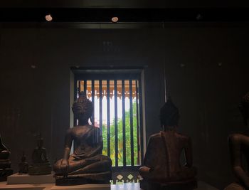 Statue in illuminated room